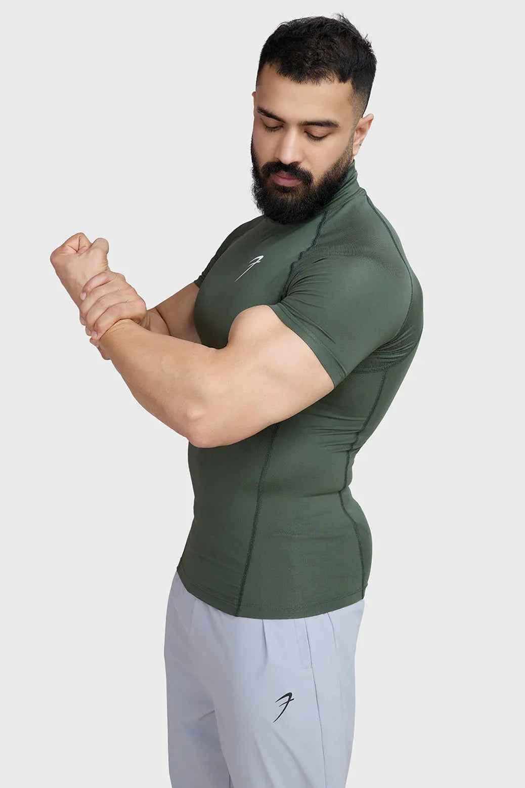 Olive high neck compression T-shirt by Fuaark Nz, close-up view highlighting the fitted design and smooth fabric.