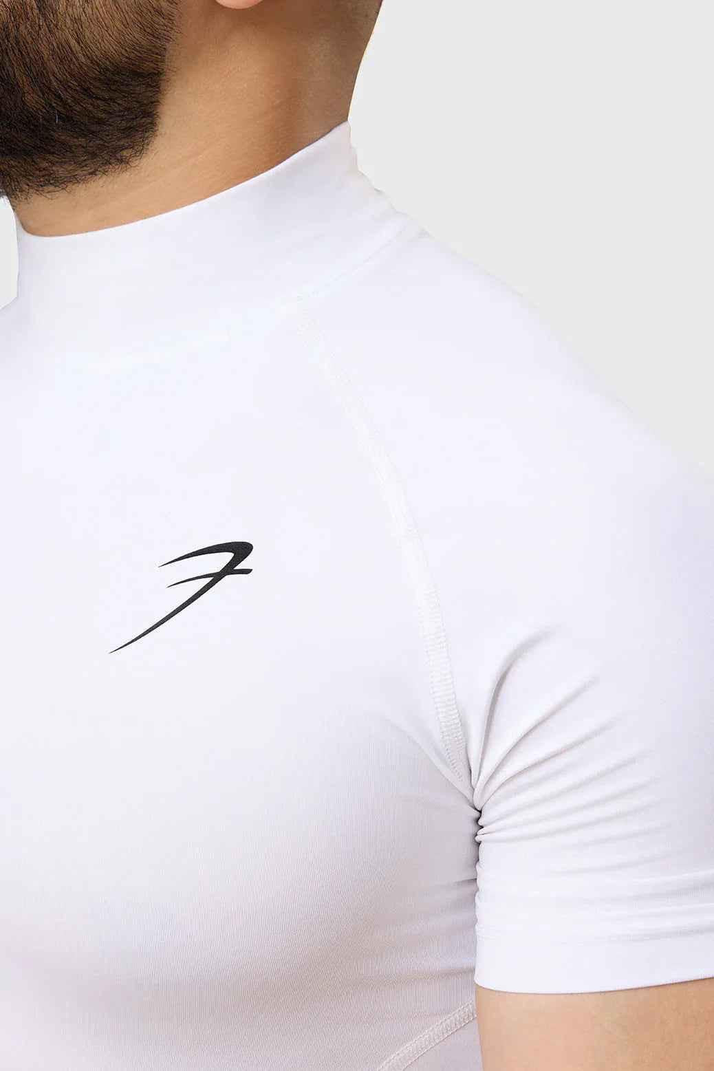 White high neck compression T-shirt by Fuaark Nz, close-up of the fitted, stretchy fabric and sleek design.