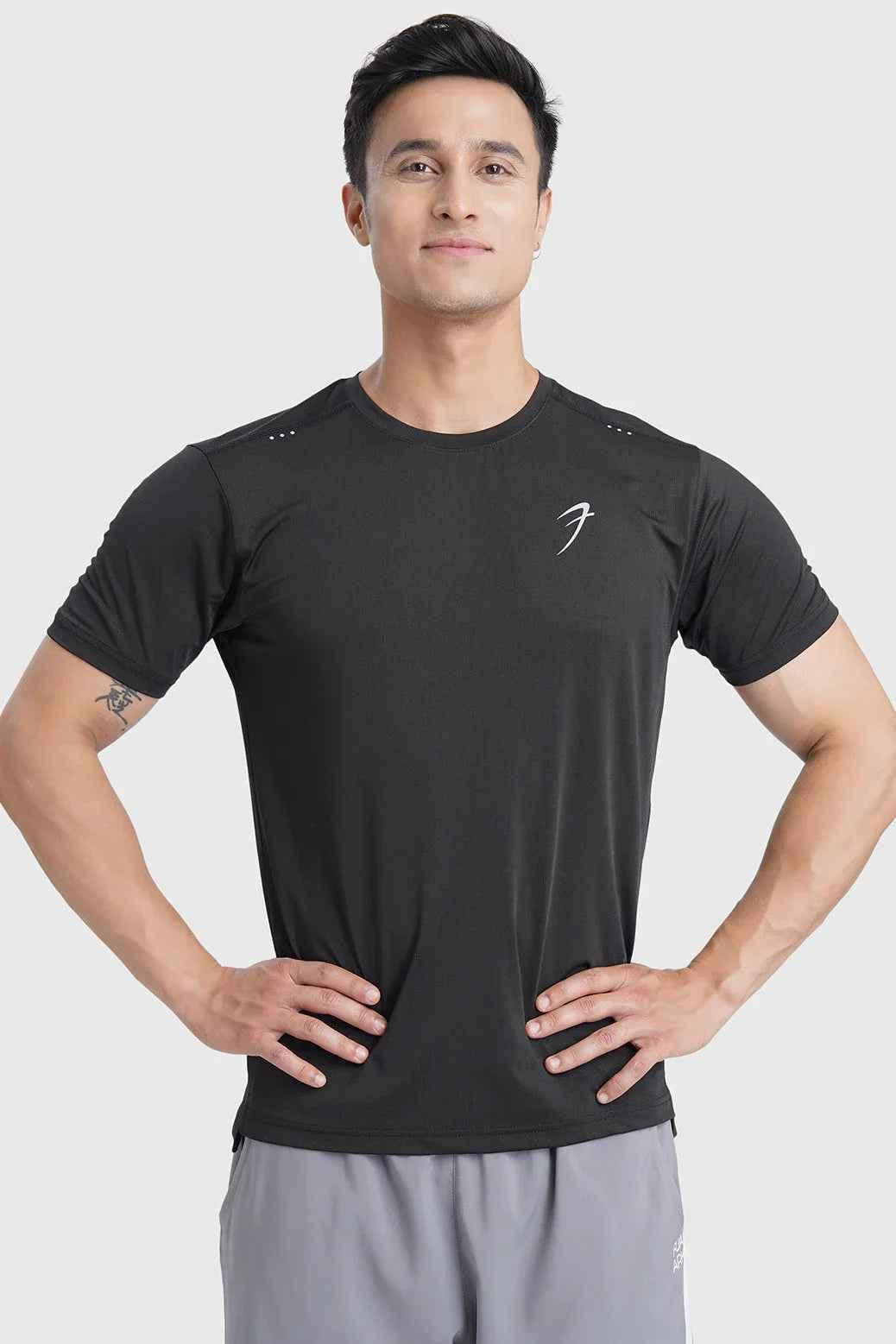 Black laser cut running T-shirt by Fuaark NZ, showing detailed laser cut design and breathable fabric on a mannequin.