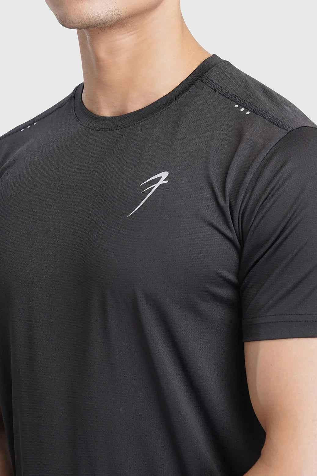 Black laser cut running T-shirt by Fuaark NZ, featuring breathable fabric and stylish design for activewear.