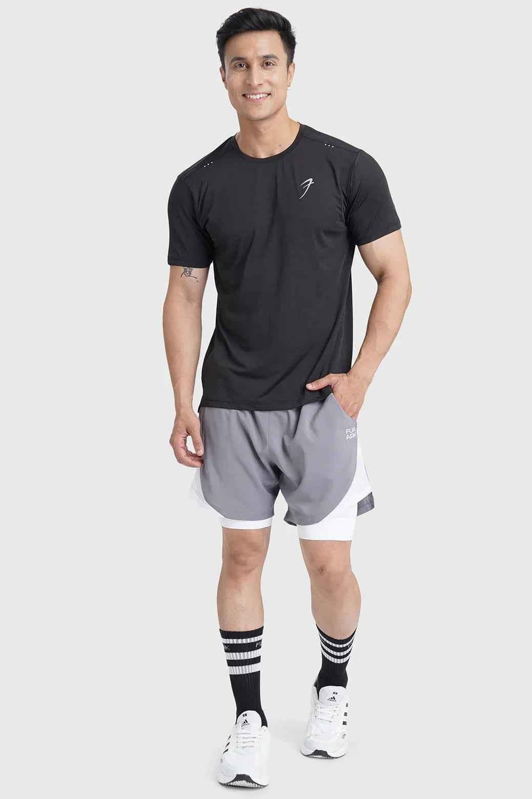 Black laser-cut running T-shirt by Fuaark NZ, showing close-up of detailed laser cut design on breathable athletic T-shirt.