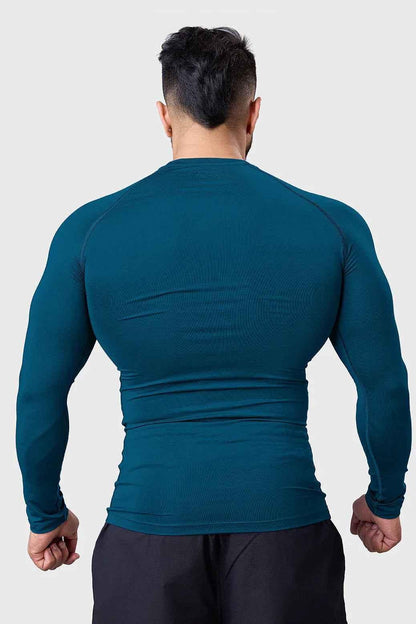 Men's teal compression long sleeve shirt by Fuaark NZ, breathable and quick-dry gym top designed for active wear.