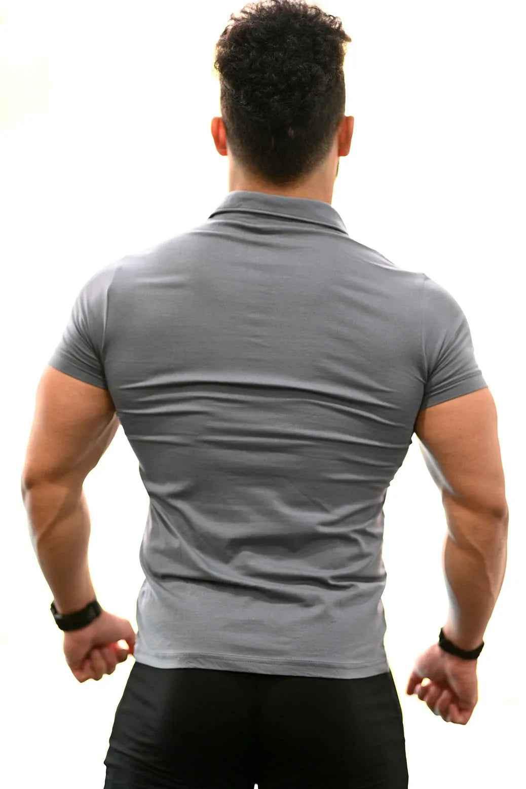 Grey Polo T-shirt by Fuaark Nz, showcasing a classic fit with a collar and short sleeves on a plain background.