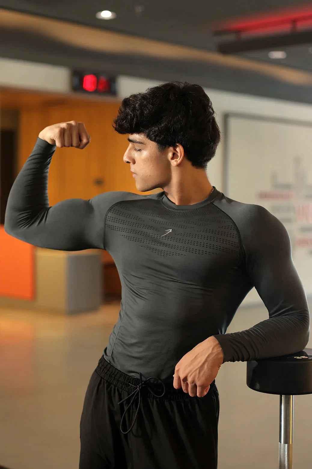 Charcoal Power Seamless Fullsleeves T-shirt by Fuaark NZ, close-up of fitted, smooth fabric on a mannequin.