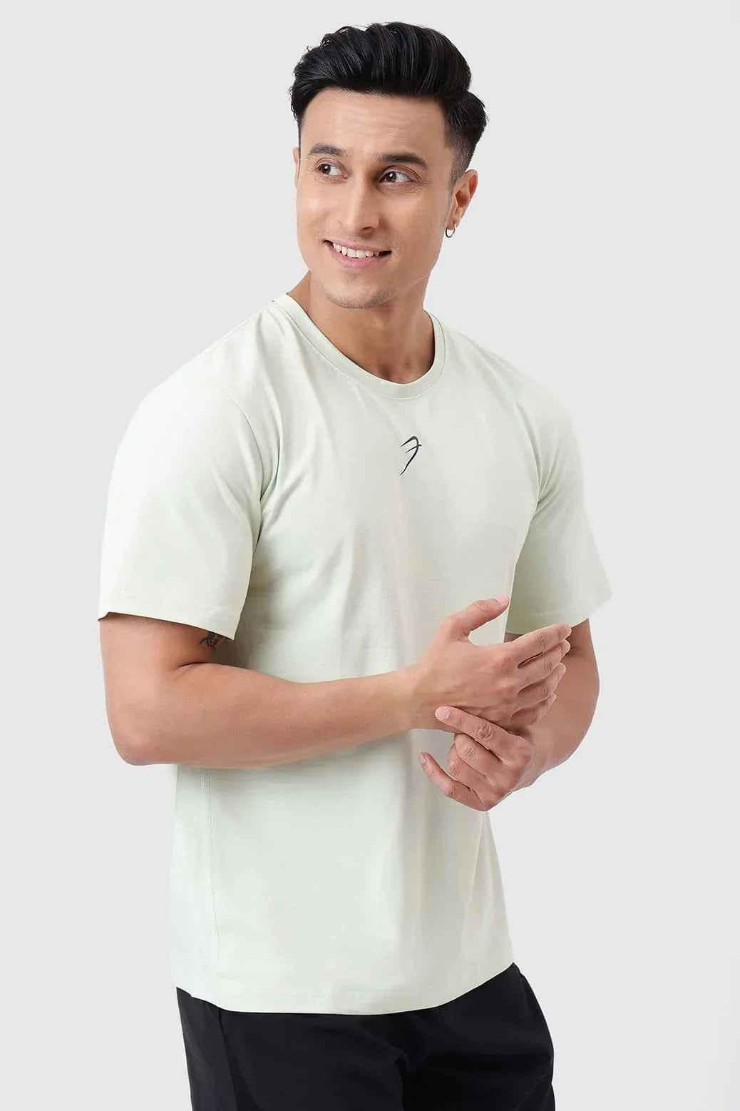 Green running T-shirt by Fuaark Nz, designed for comfort and performance, shown on a mannequin.