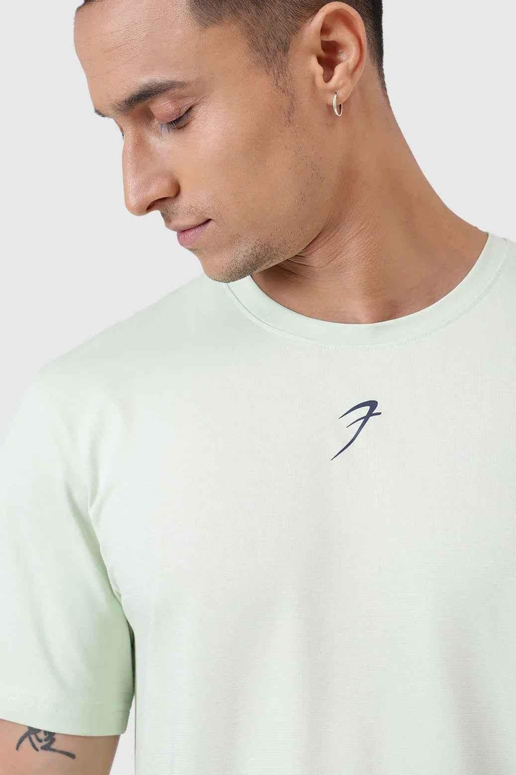 Green Fuaark Nz running T-shirt designed for comfort and performance, shown on a model with breathable fabric and athletic fit.