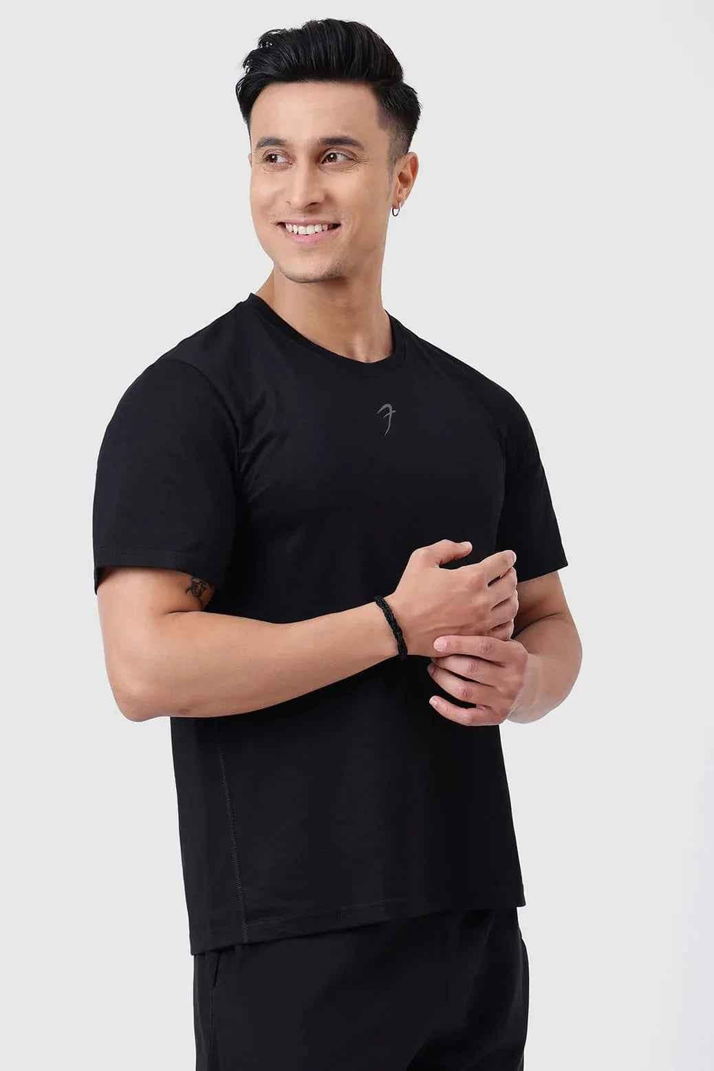 Black Pulse Running T-shirt by Fuaark Nz, showcasing a casual athletic T-shirt with a modern fit and logo detail.