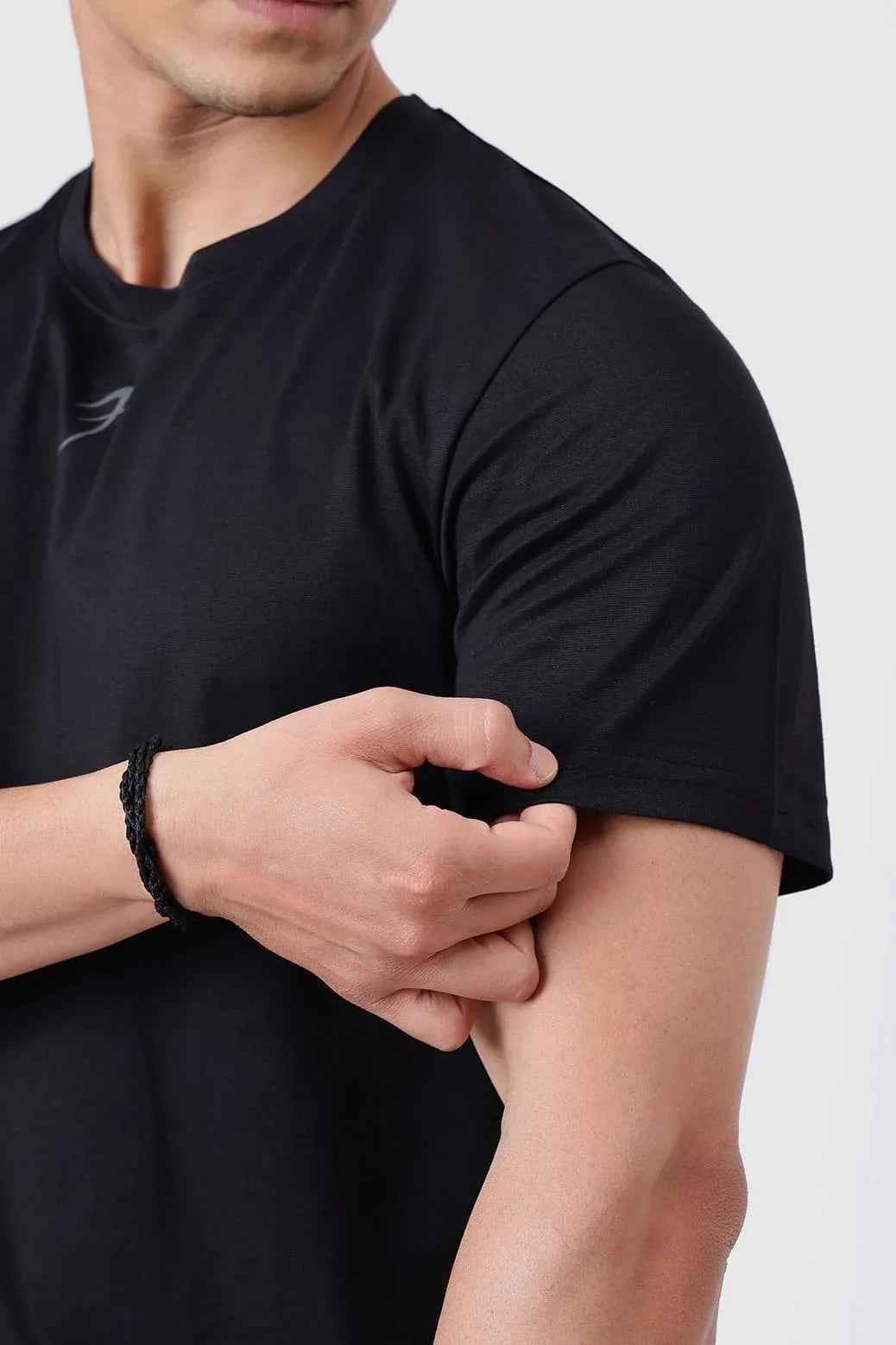 Black Pulse Running T-shirt by Fuaark NZ, lightweight athletic tee with breathable fabric and sporty design.