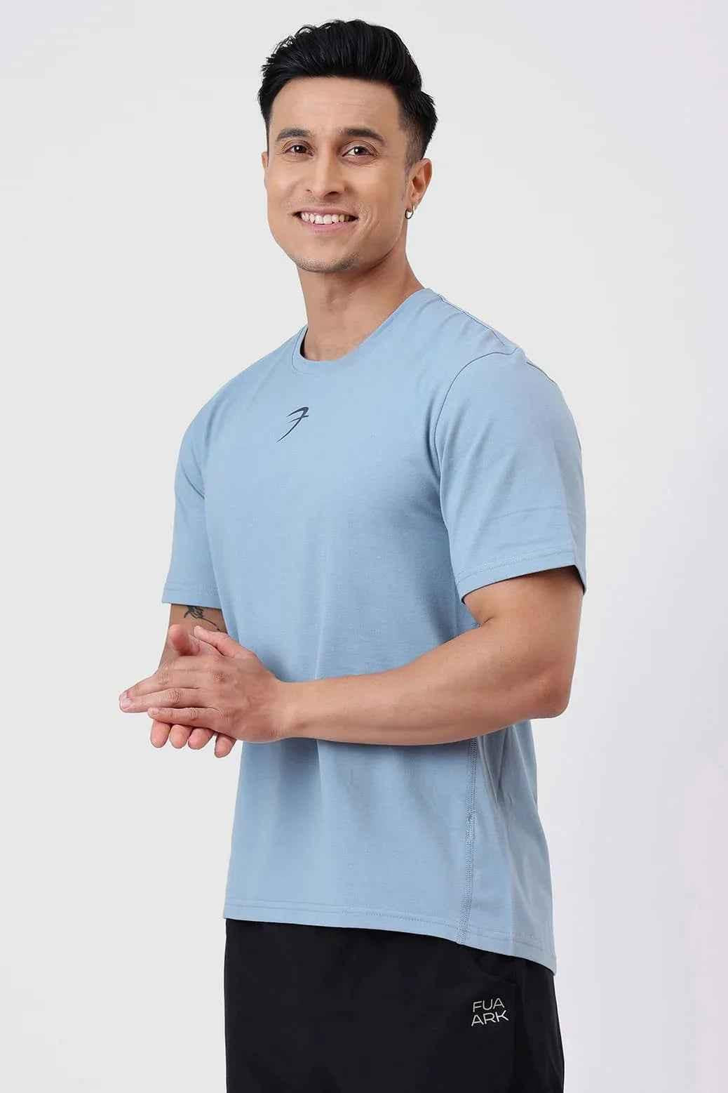 Light blue Pulse Running T-shirt by Fuaark Nz, featuring a comfortable fit and breathable fabric for activewear.