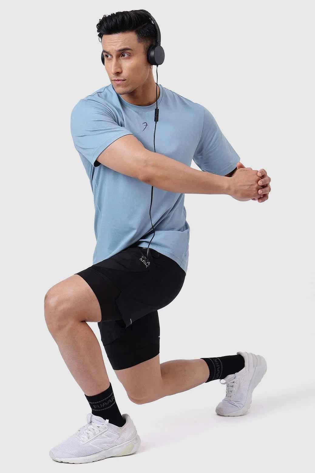 Light blue Pulse Running T-shirt by Fuaark Nz, casual athletic shirt with breathable fabric and sporty design.
