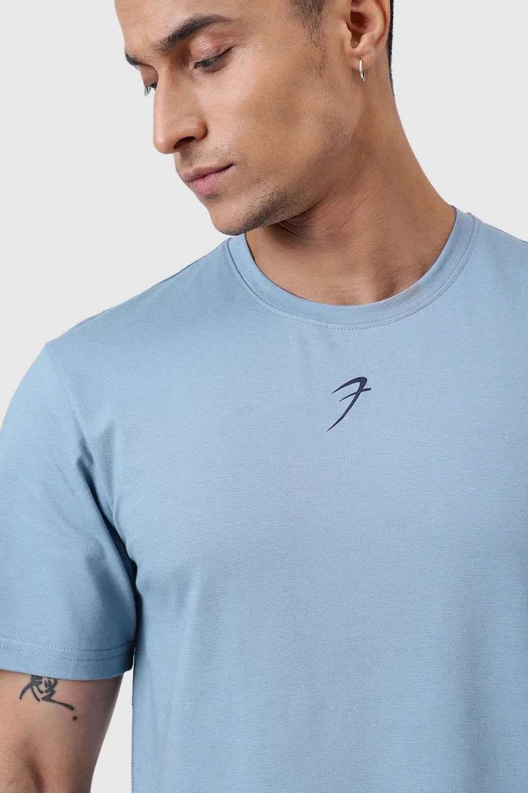 Light blue Pulse Running T-shirt by Fuaark Nz, showcasing the breathable fabric and athletic fit designed for active wear.