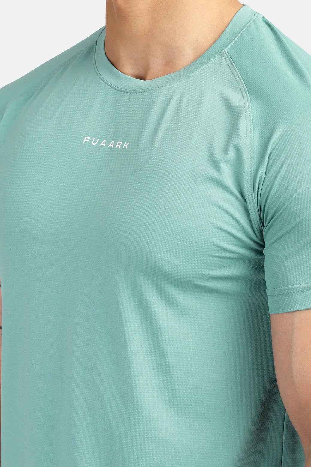 Green Sleek T-shirt by Fuaark Nz, featuring a fitted design and soft fabric, displayed on a plain background.