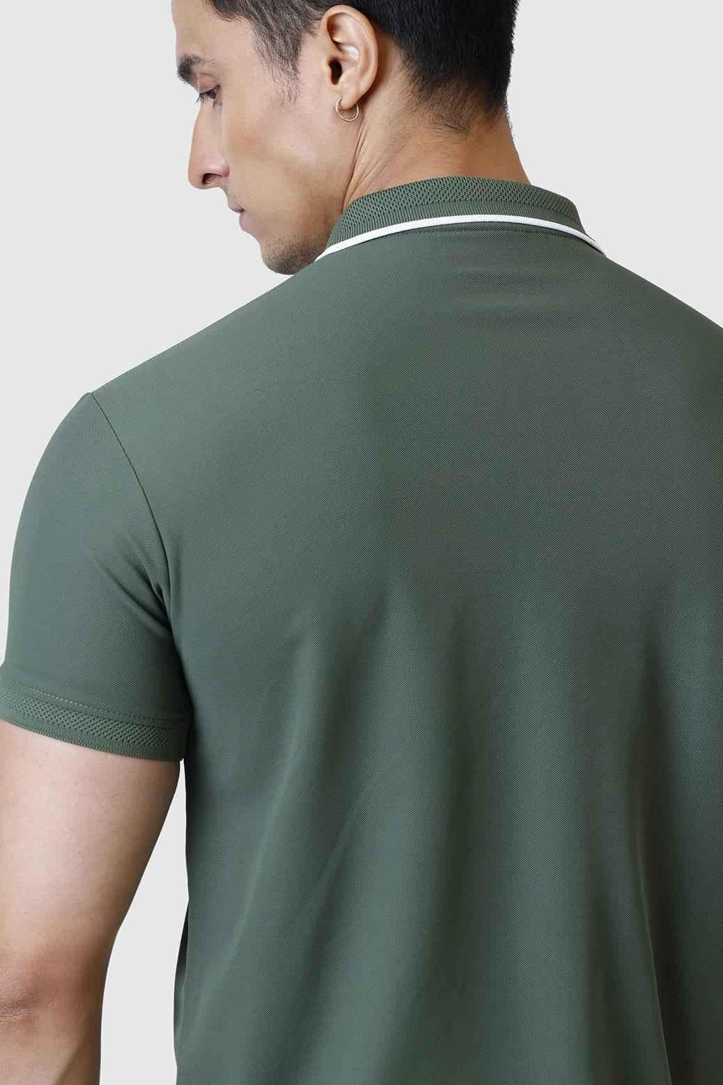 Olive green Fuaark Nz Stride Polo T-shirt laid flat, showcasing short sleeves and classic collar.
