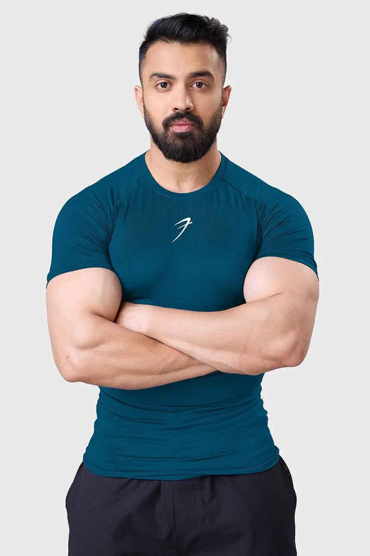 Teal compression T-shirt for men by Fuaark Nz, designed to enhance workout performance and provide a snug, supportive fit.