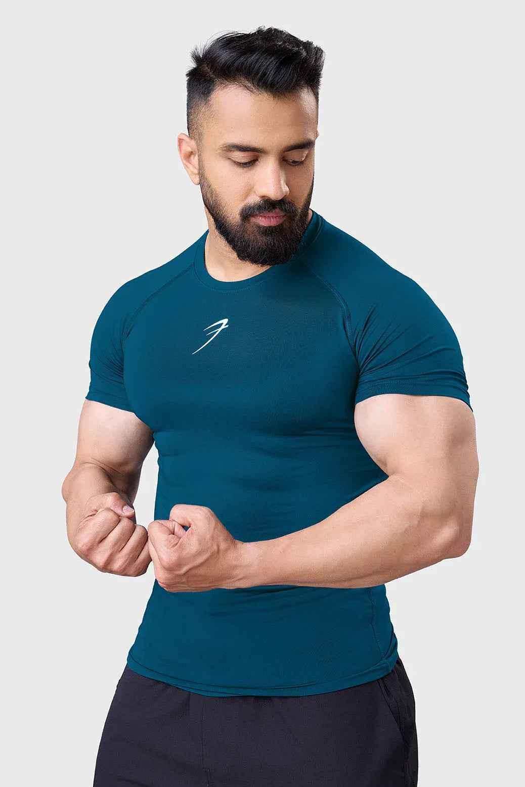 Teal Fuaark NZ men's compression T-shirt designed for enhanced workout performance, fitted and breathable for active use.