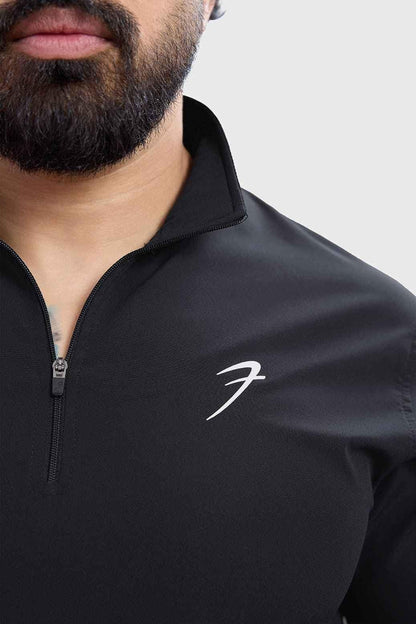 Black T-shirt pullover from Fuaark Nz featuring a comfortable fit and casual style, shown on a plain background.