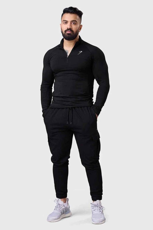 Black Thrive pullovers T-shirt by Fuaark NZ, featuring a comfortable fit and minimalist design, shown on a plain background.