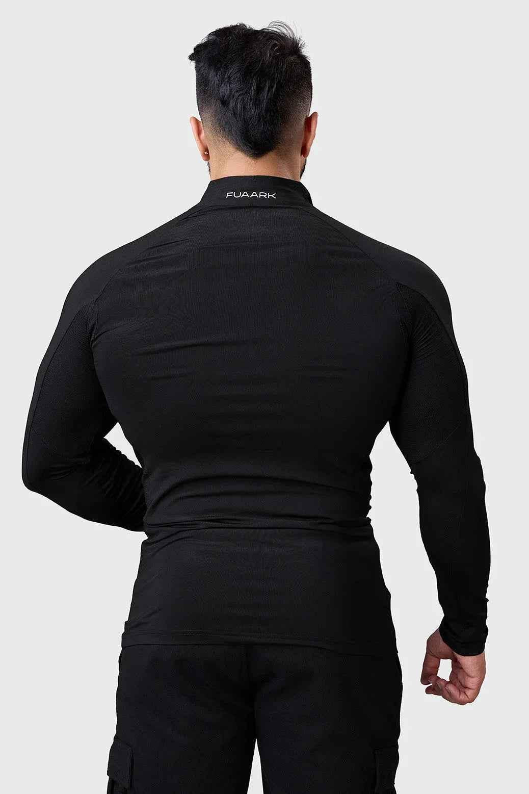 Black Thrive Pullover T-shirt by Fuaark NZ featuring a comfortable fit and casual style, shown on a model.