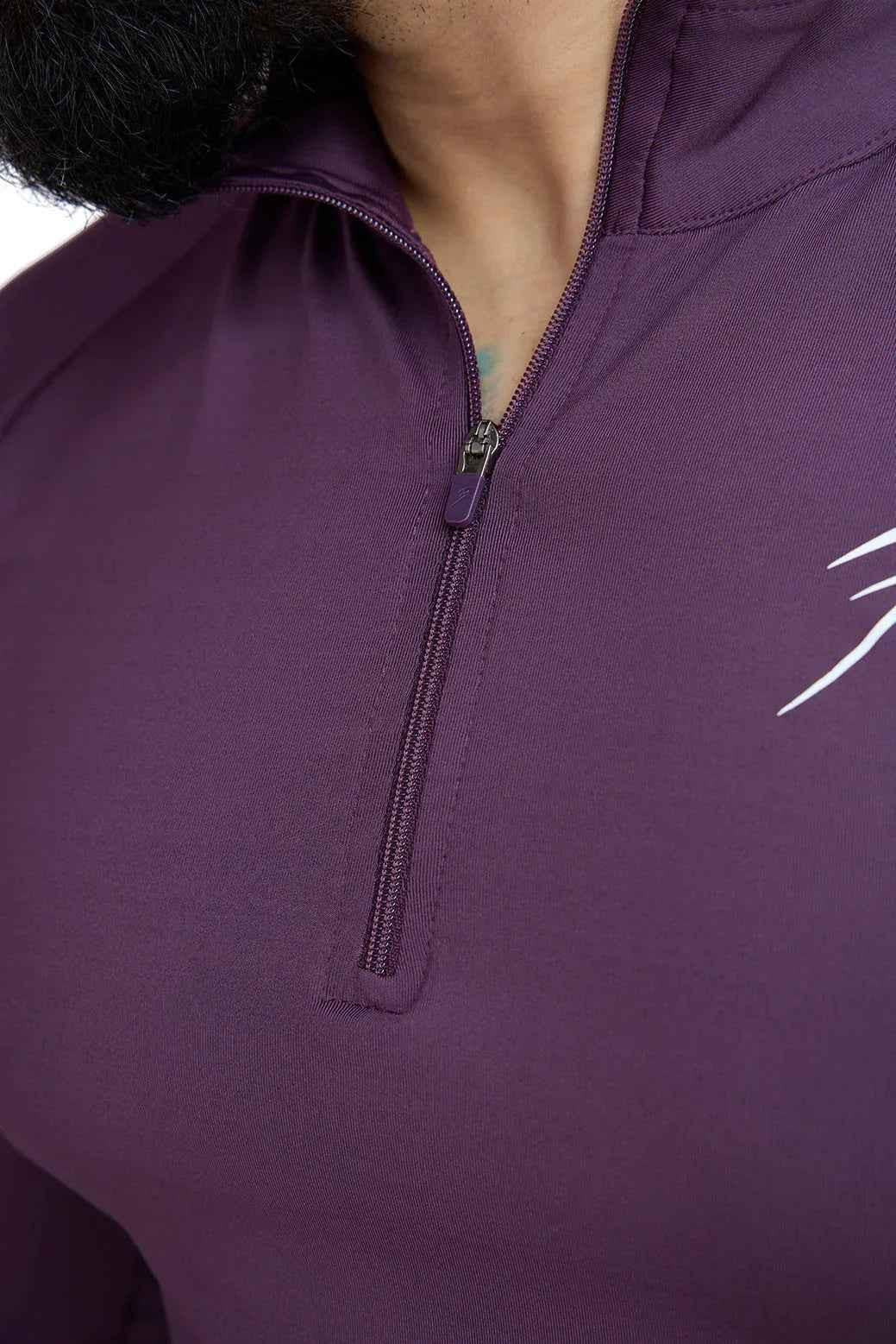 Fuaark Nz Thrive Pullovers Plum T-shirt displayed on a hanger, showcasing its soft fabric and vibrant plum color.