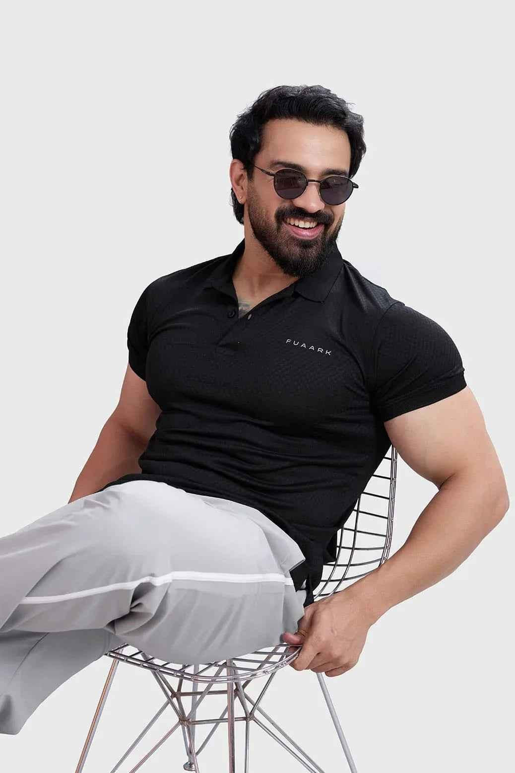 Black Wave Polo T-shirt by Fuaark Nz, featuring a classic fit and subtle wave design on soft cotton fabric.