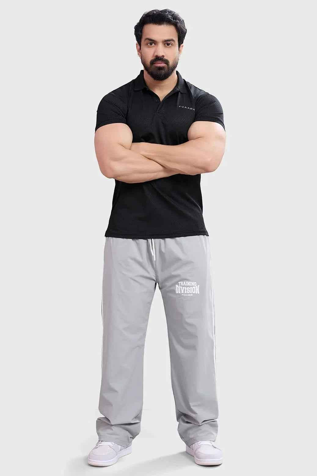Black Wave Polo T-shirt by Fuaark Nz, showcasing a casual fit with a stylish wave design on the front.