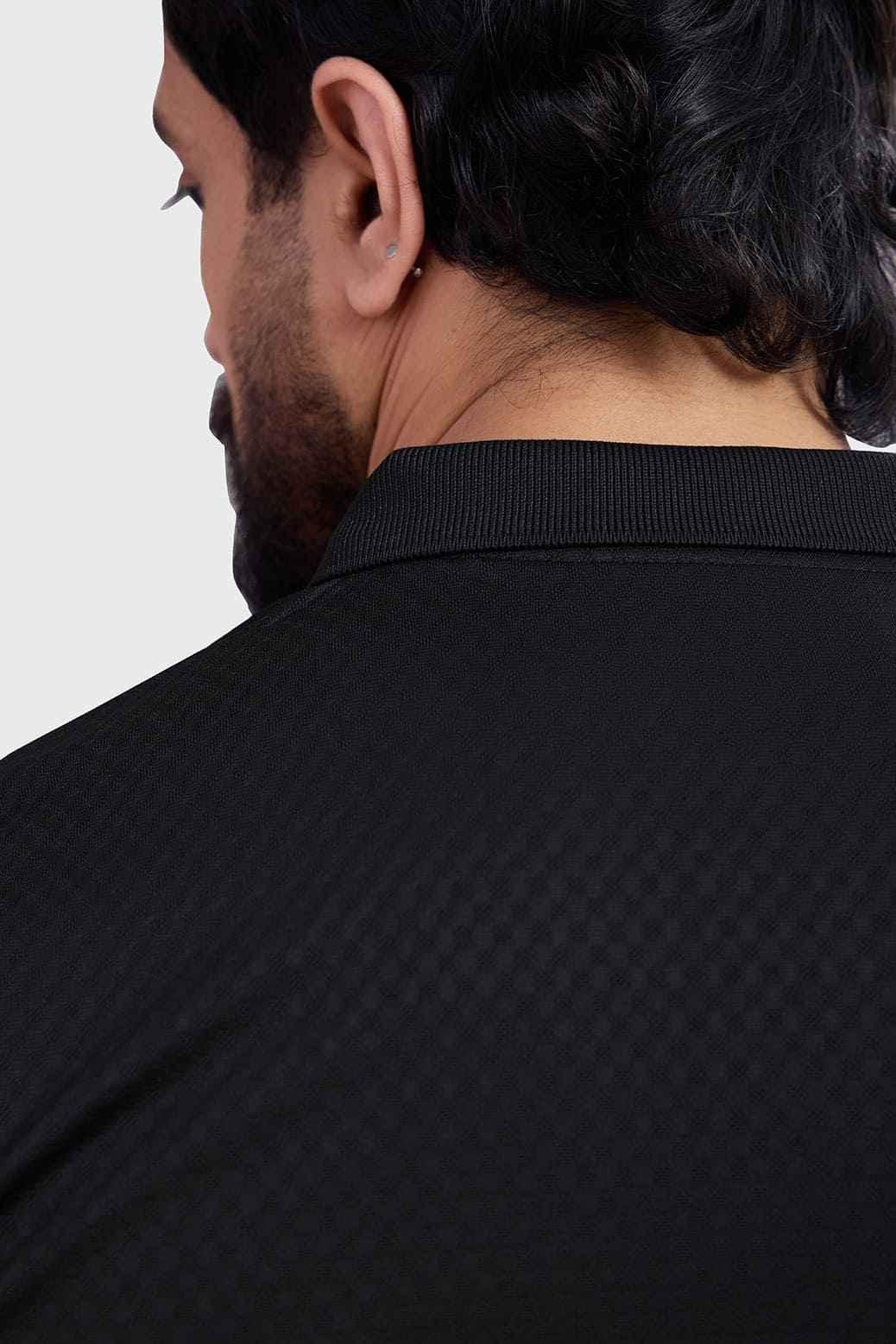 Black Wave Polo T-shirt by Fuaark NZ featuring a classic collar, short sleeves, and a sleek, modern design.