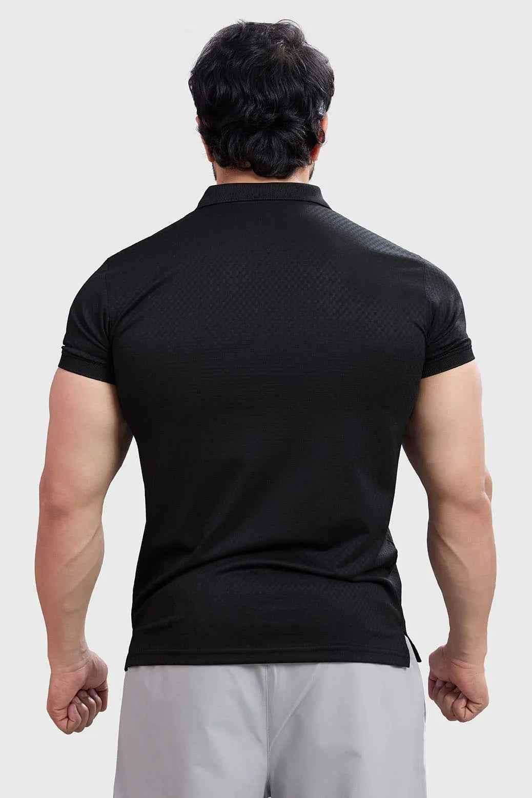 Black Wave Polo T-shirt by Fuaark Nz, featuring a classic fit and subtle wave design on the chest.