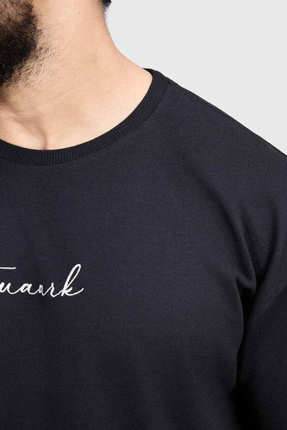Black oversized T-shirt by Fuaark Nz, featuring bold design, casual fit, and soft fabric for effortless style and comfort.