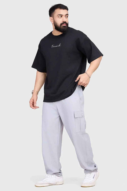Black oversized T-shirt from Fuaark Nz, showcasing a relaxed fit and casual style, perfect for effortless comfort and everyday wear.