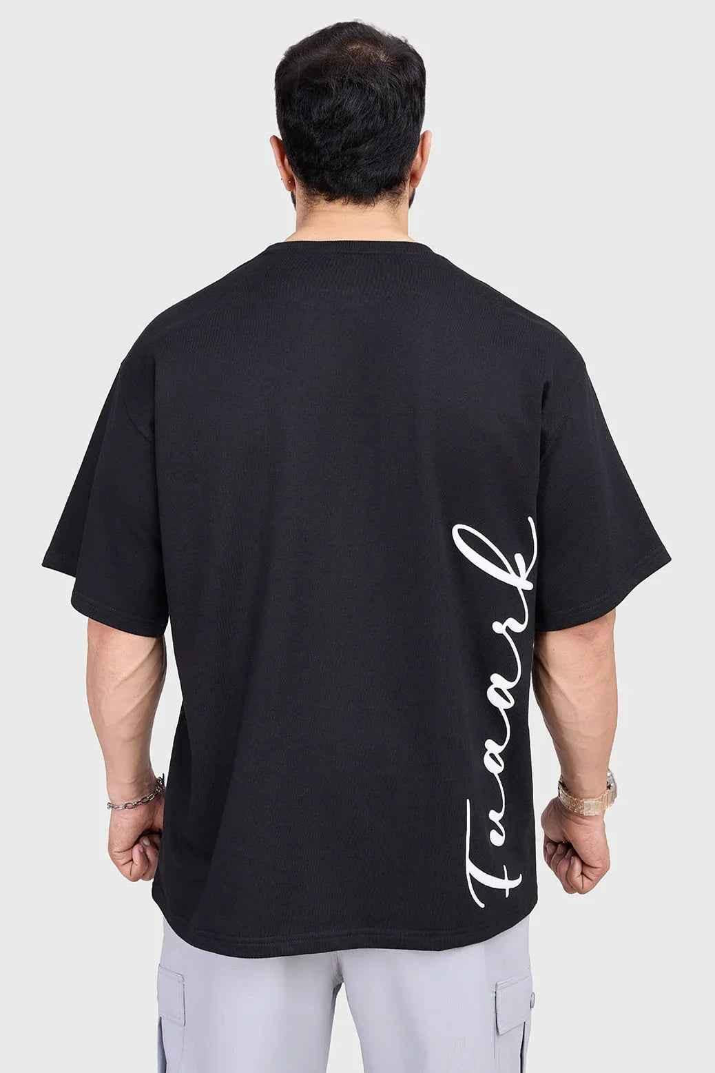 Black oversized T-shirt by Fuaark Nz with bold design, casual fit, and comfortable style, shown flat on a white background.