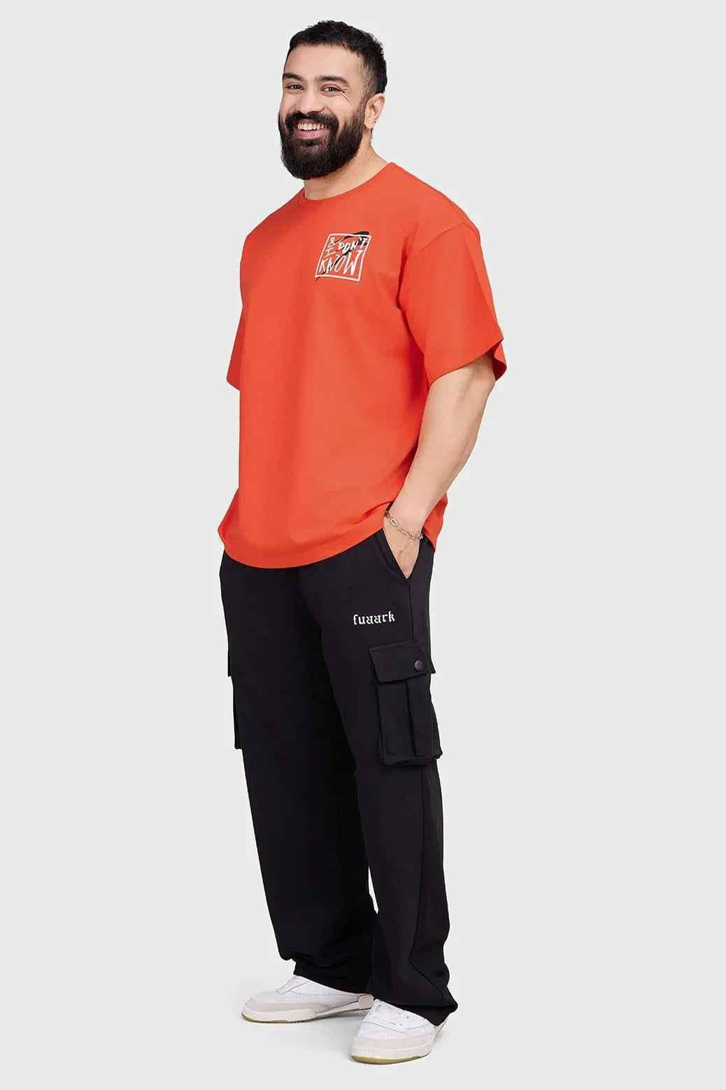 Orange oversized T-shirt by Fuaark Nz, made of premium cotton with relaxed fit, unisex streetwear style.
