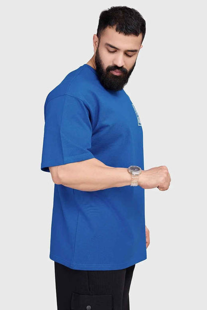 Royal blue Dapper oversized T-shirt by Fuaark Nz, shown flat with relaxed fit and short sleeves.