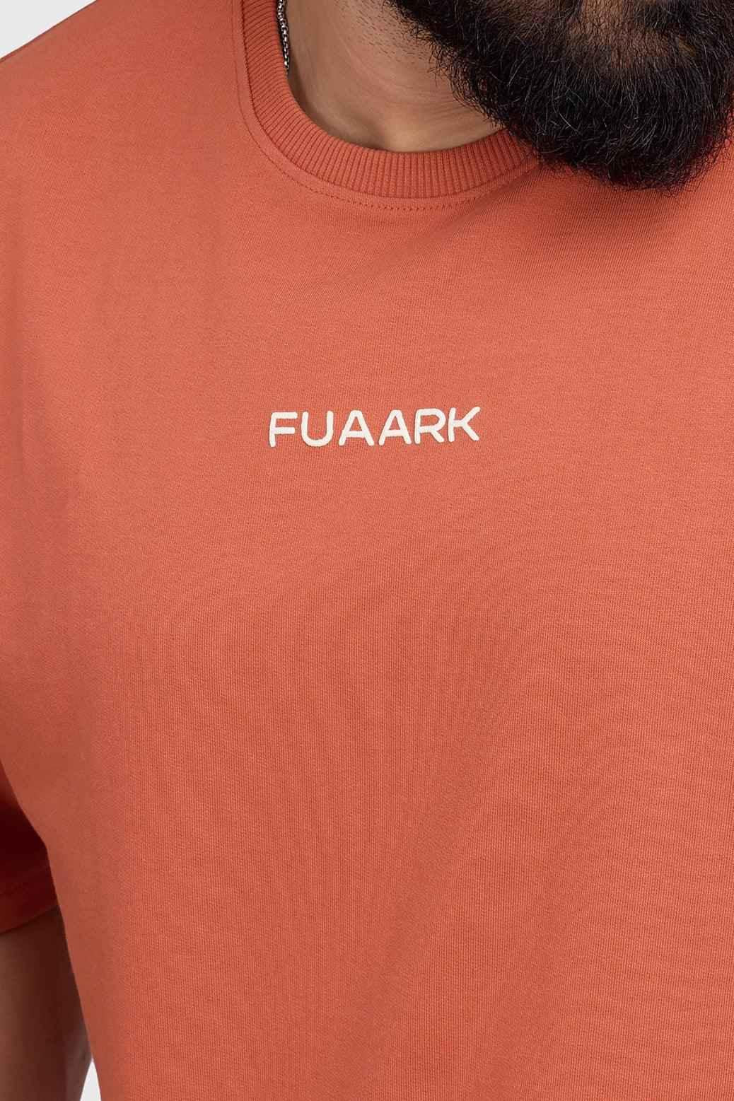 Fuaark NZ oversized rust T-shirt for women, soft cotton fabric, relaxed fit, casual style, perfect for everyday wear.