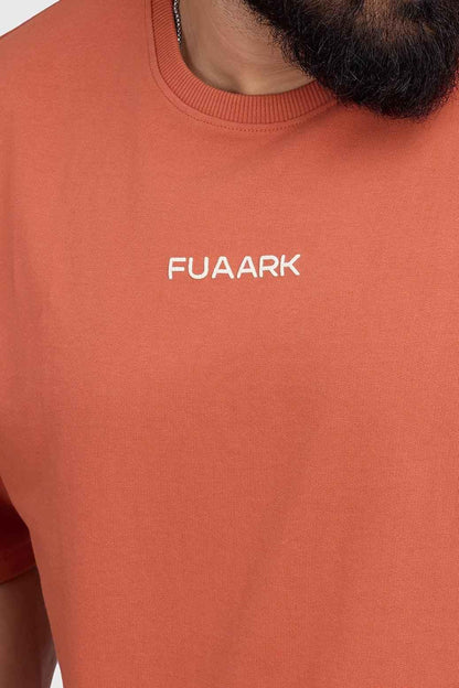 Fuaark NZ oversized rust T-shirt for women, soft cotton fabric, relaxed fit, casual style, perfect for everyday wear.