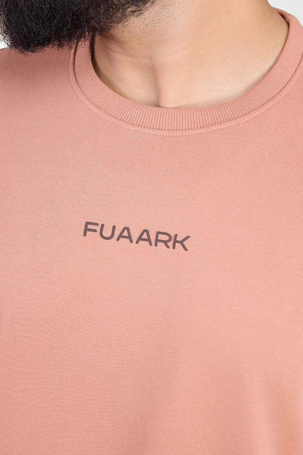 Fuaark Nz Element Oversized T-shirt in warm beige, featuring a relaxed fit and soft cotton fabric, displayed on a plain background.