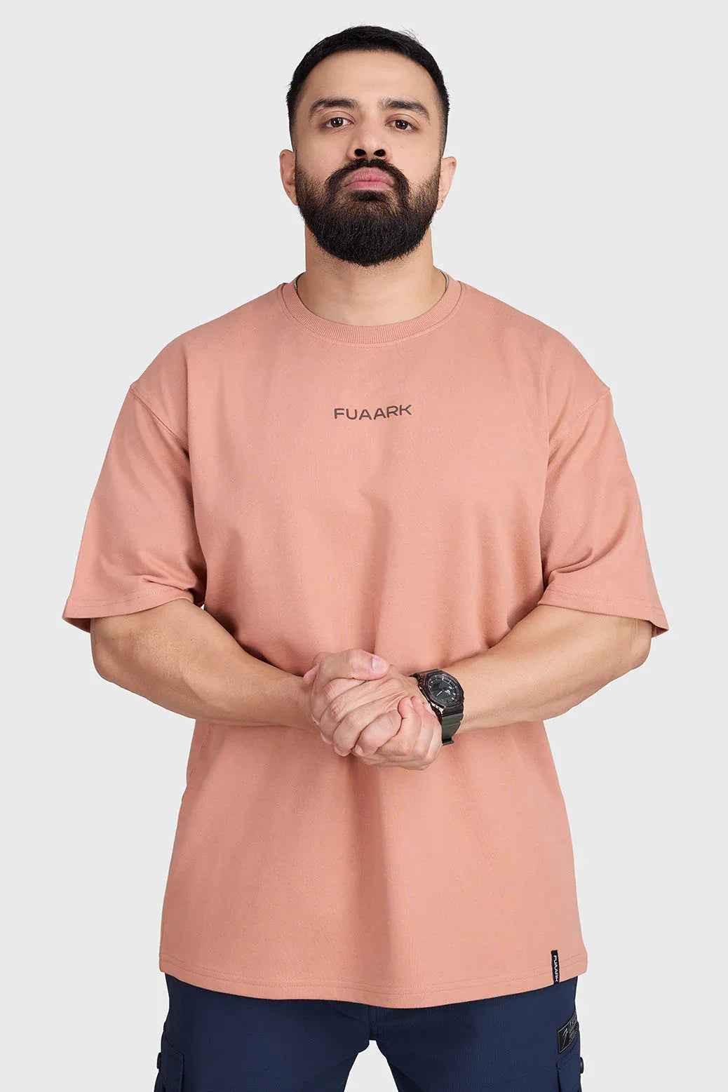 Fuaark NZ Element oversized T-shirt in warm beige, showing relaxed fit and soft fabric, laid flat on a white background.