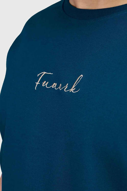 Fuaark Nz bold teal oversized T-shirt for women, casual fit, soft fabric, with a relaxed style and minimal branding visible.
