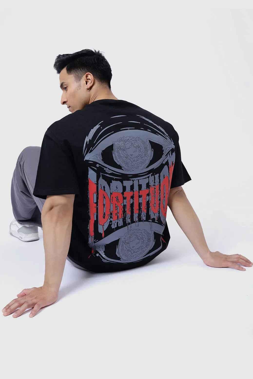 Black oversized Fortitude T-shirt by Fuaark Nz, featuring a relaxed fit and soft cotton fabric.