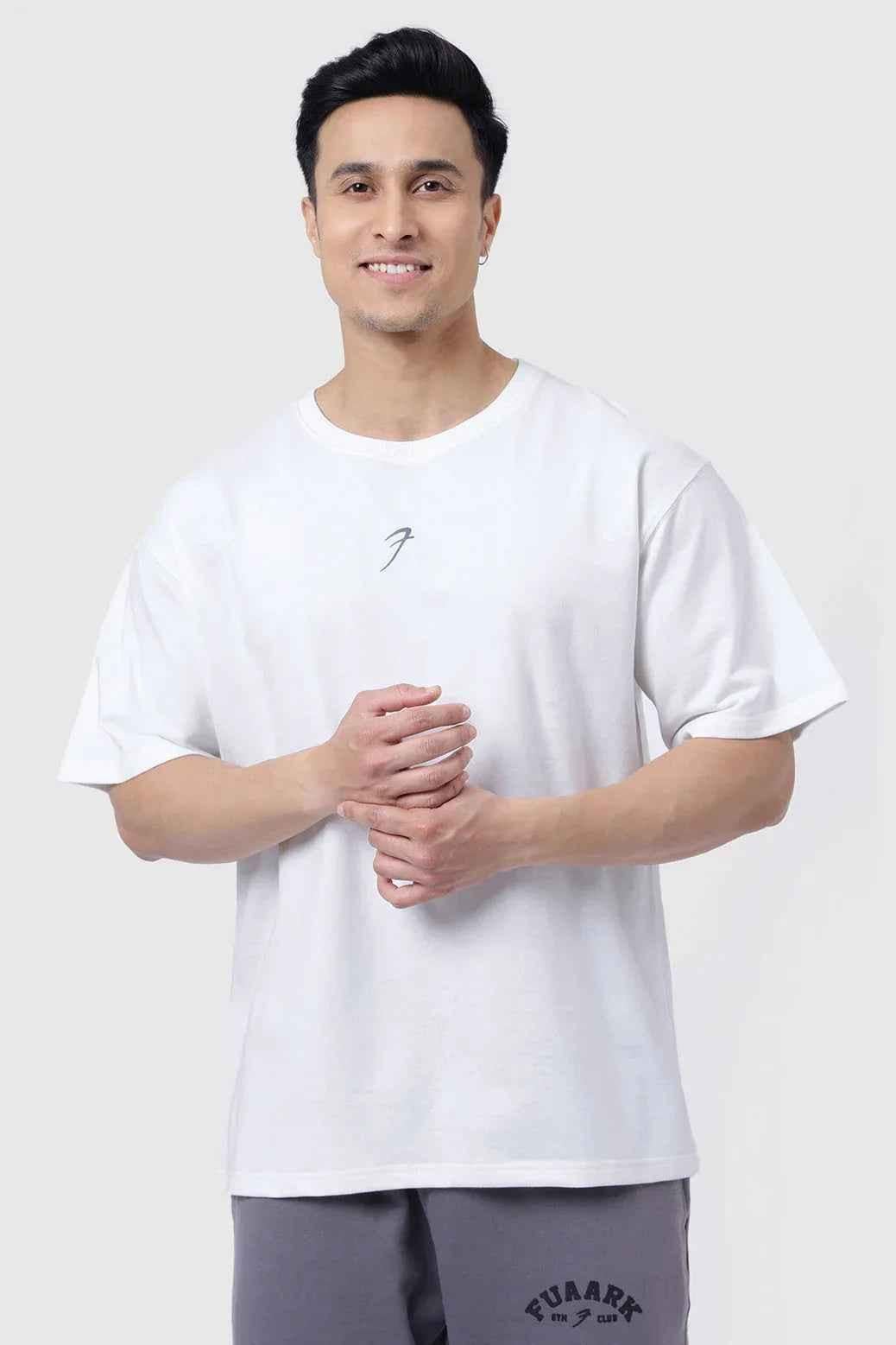 White oversized Fortitude T-shirt by Fuaark Nz featuring a relaxed fit and casual style, shown on a plain background.