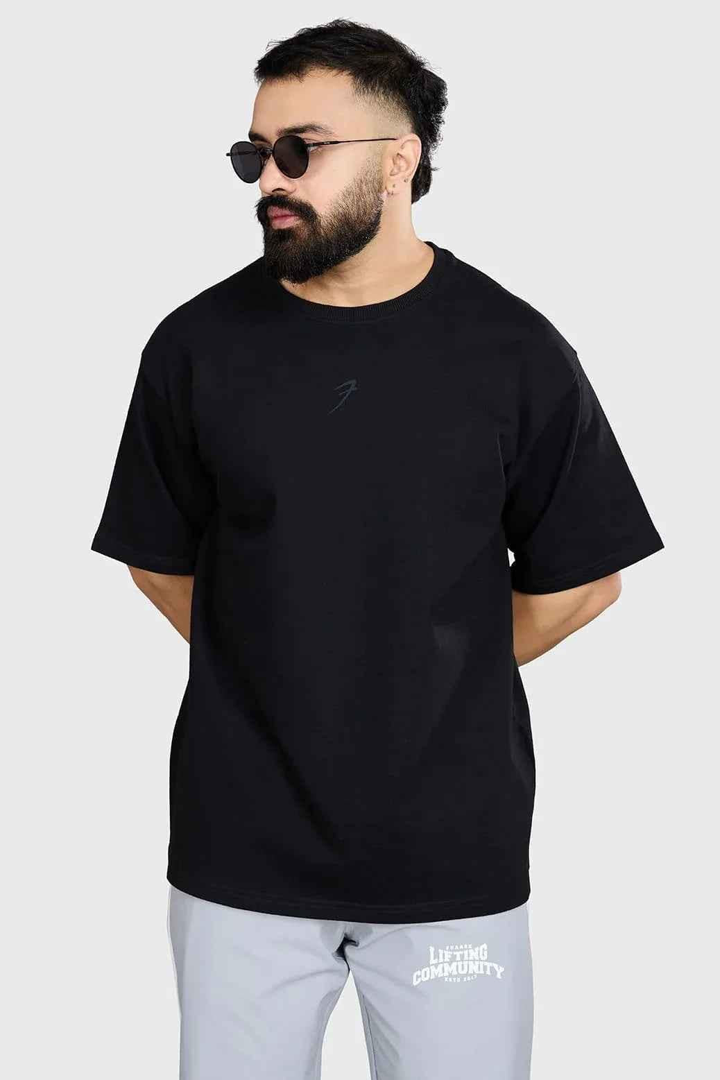 Black heavyweight oversized T-shirt by Fuaark Nz, showcasing a comfortable and stylish fit with a relaxed, casual design.
