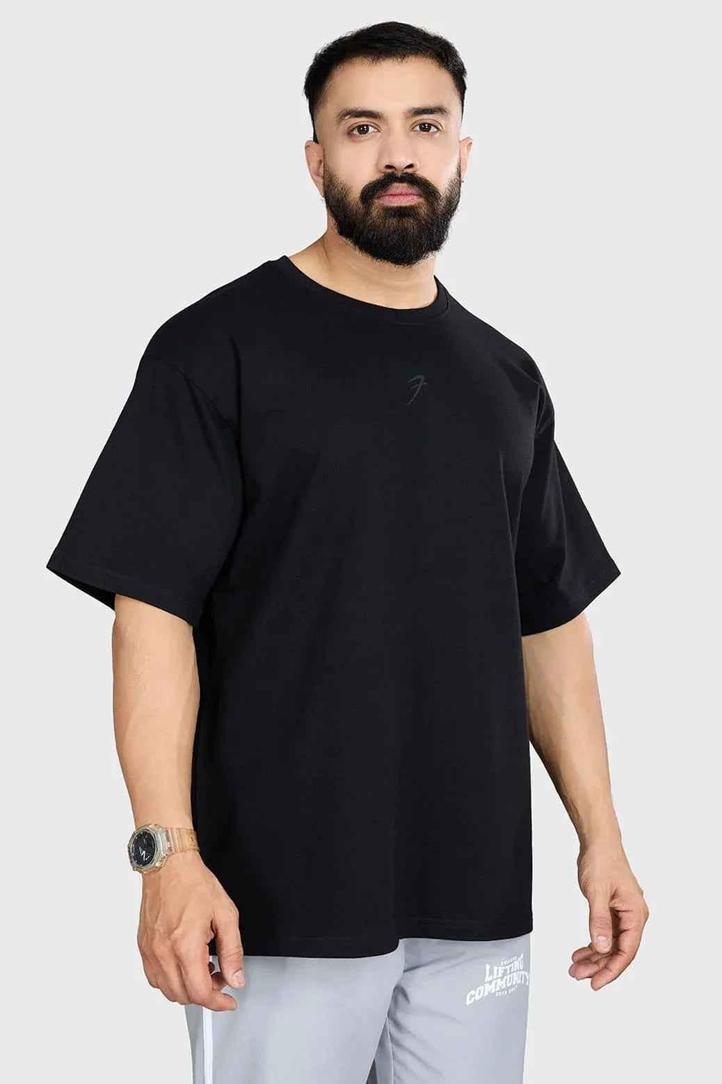 Fuaark Nz heavyweight oversized black T-shirt for men, casual fit, soft fabric, designed for comfort and style.