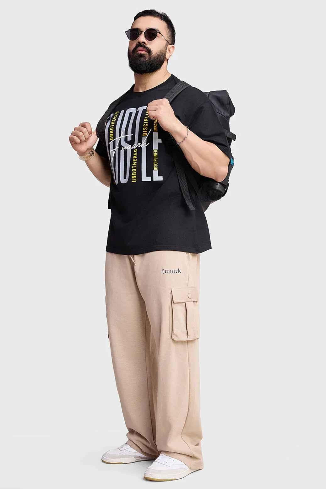 Black Hustle oversized T-shirt by Fuaark NZ, casual fit with bold front graphic, short sleeves, and relaxed style.
