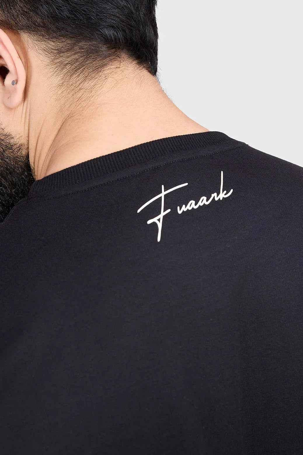 Black Hustle oversized T-shirt by Fuaark Nz, featuring a relaxed fit and casual style, shown on a plain background.
