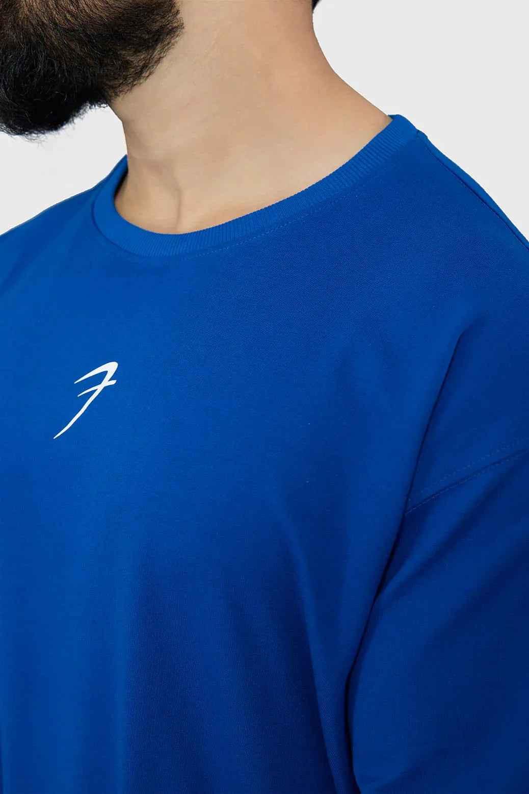 Fuaark Nz oversized royal blue T-shirt for men, featuring a relaxed fit and soft fabric for ultimate comfort and style.