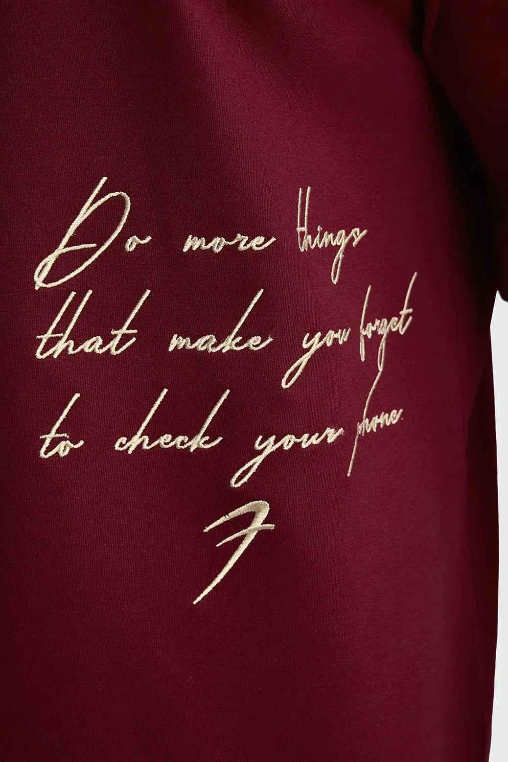 Maroon oversized T-shirt by Fuaark Nz featuring a relaxed fit and stylish design, perfect for effortless casual wear.
