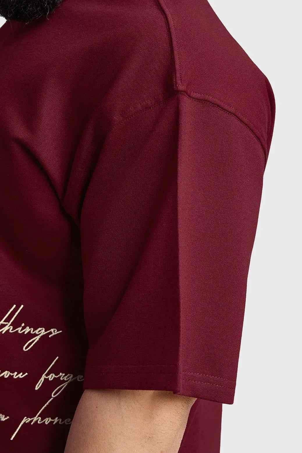 Maroon oversized T-shirt by Fuaark Nz, featuring a relaxed fit and casual style, ideal for effortless everyday wear.