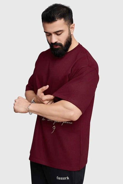 Maroon oversized T-shirt by Fuaark Nz featuring a relaxed fit and casual style, made from soft, comfortable fabric.