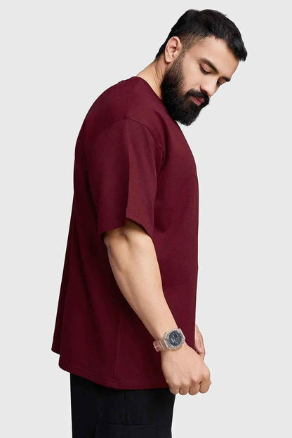 Maroon oversized T-shirt for women by Fuaark Nz, featuring a relaxed fit and stylish design for effortless casual wear.