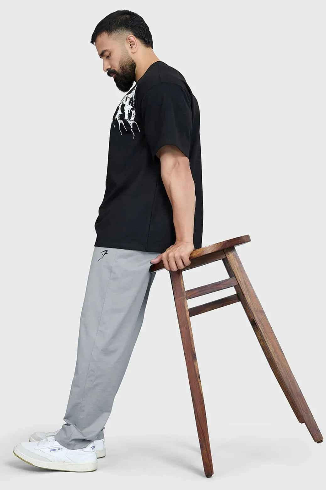 Black Levitate Oversized T-shirt by Fuaark Nz, featuring a relaxed fit and modern design, displayed on a plain background.