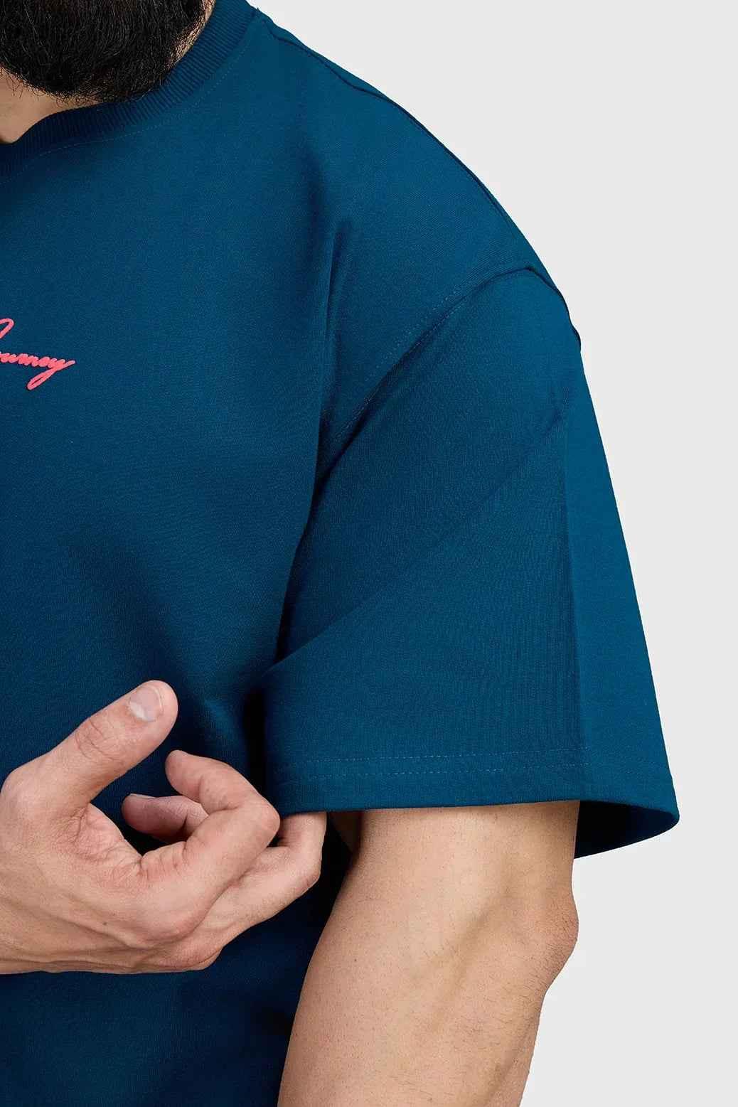 Fuaark Nz Respect The Journey oversized teal T-shirt, casual and stylish fit, shown on a person with a relaxed stance.